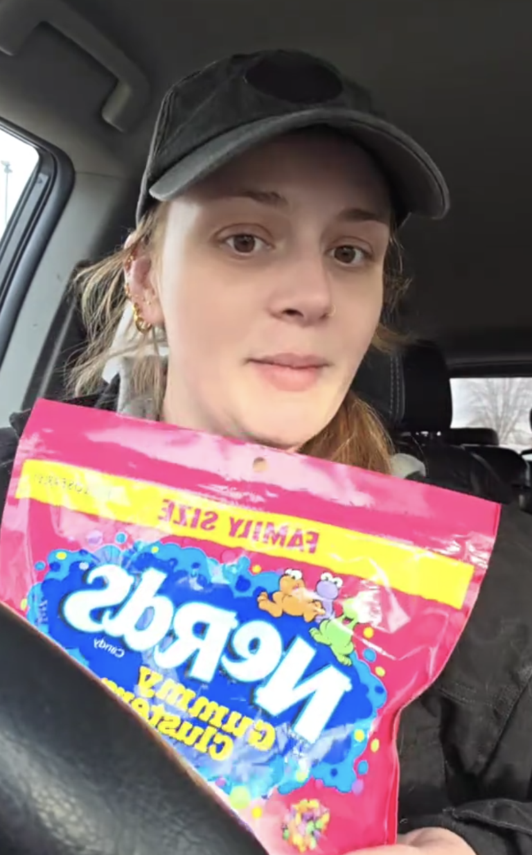 woman holding a bag of candy